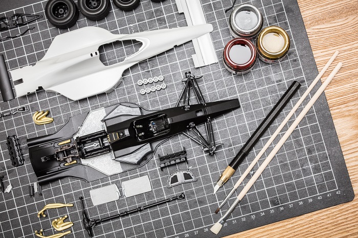 Toy Model Car Parts On A Desk